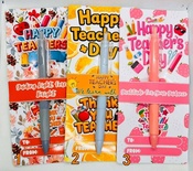 A colorful pen as a gift, in a gift package mentioning Happy Teachers Day